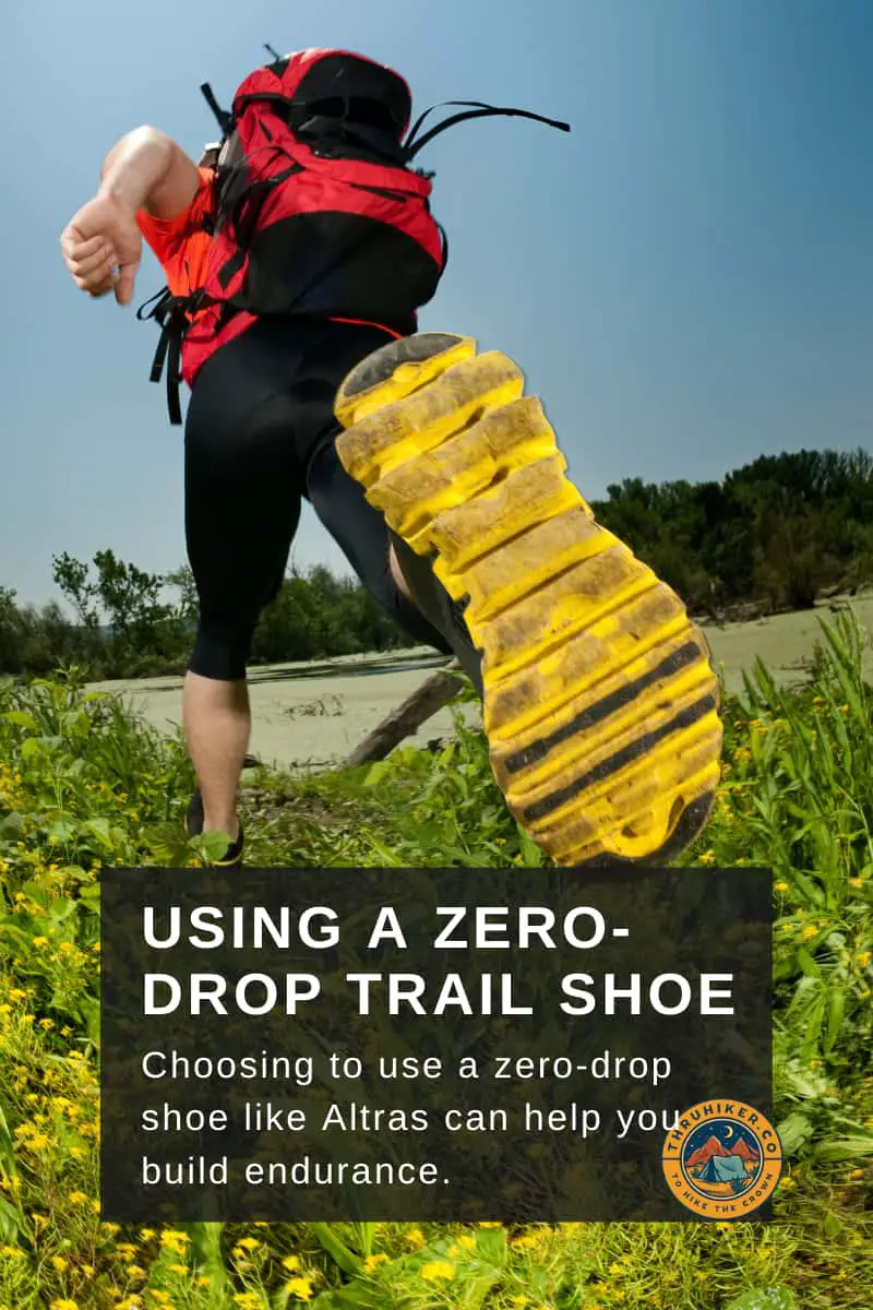 Image of someone with a backpack wearing zero drop shoes to hike on the grass