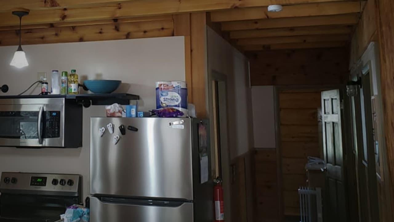Hostel kitchen space and hallway to rooms