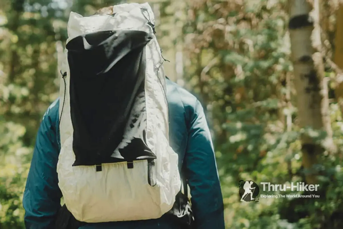 Hiker using the Outdoor Vitals CS40 Ultra backpack out on the trail